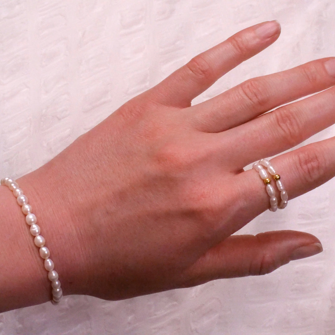 Reis Perlen Ring mit vergoldeter Perle