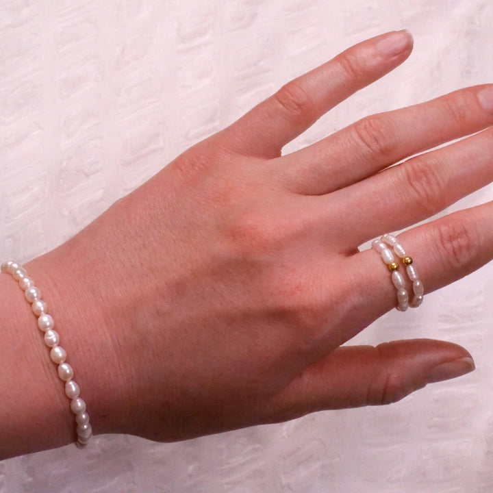 Reis Perlen Ring mit vergoldeter Perle